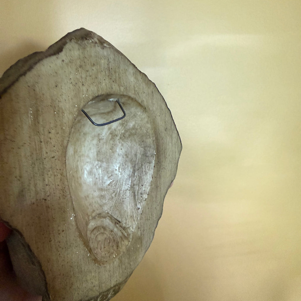 Hanging Face Sculpture