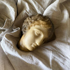 Hanging Face Sculpture